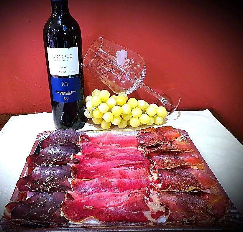 Board of Iberian charcuterie with cecina, loin and chorizo, served with red wine, Toledo